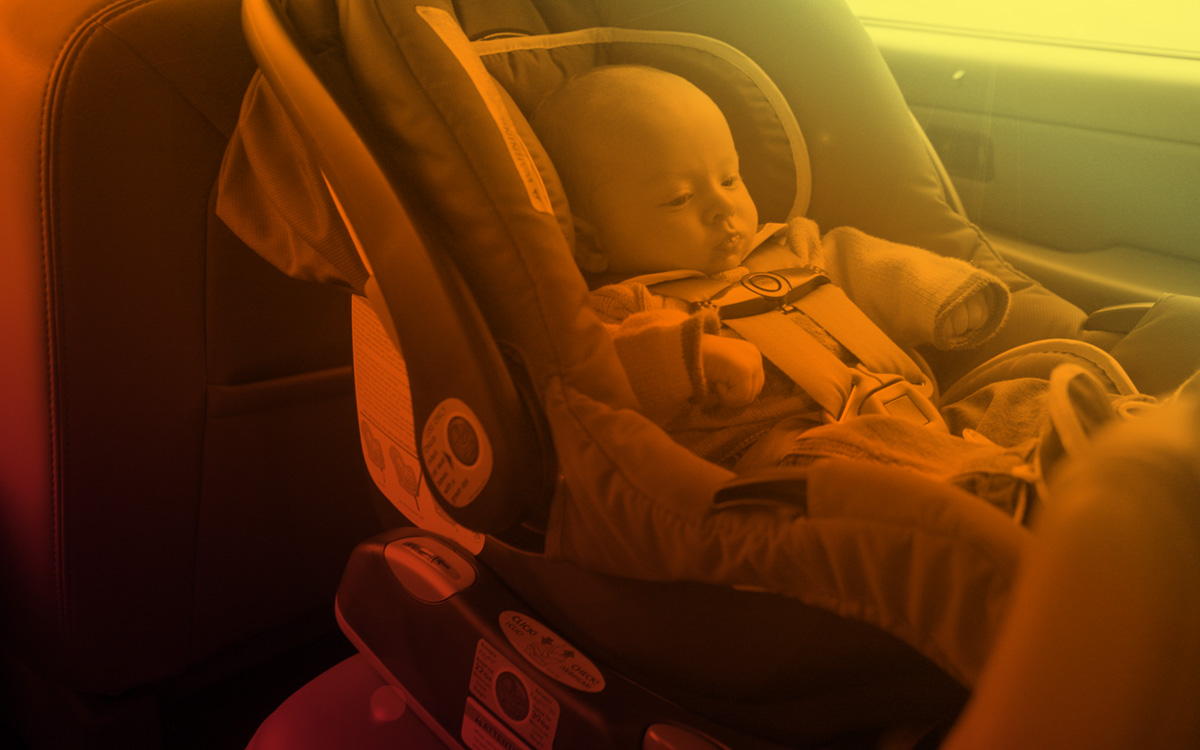 Child in car seat inside hot car Child in car seat inside hot car