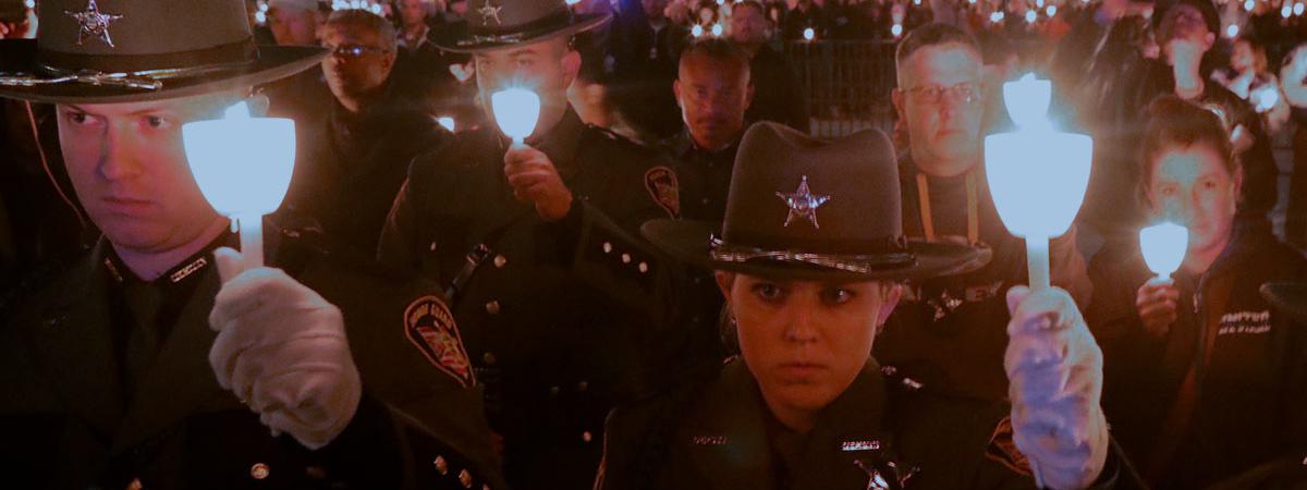 Police holding candles near Washington Monument Police holding candles near Washington Monument