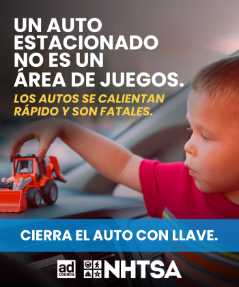 Child playing with toy truck in a hot car