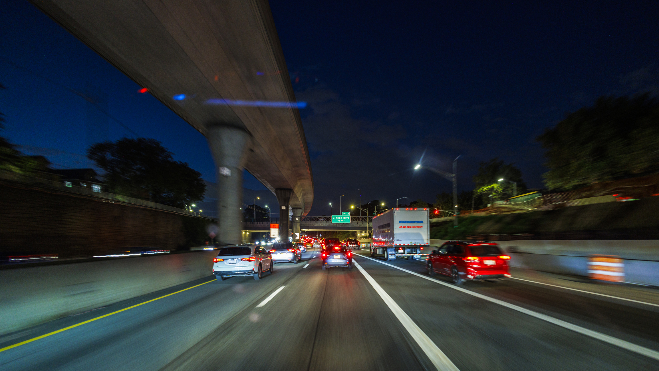 driving and night under a bridge. POV of driver