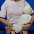 Adult crash test dummy holding a baby dummy