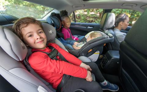 Children in back seat of car in proper car seats